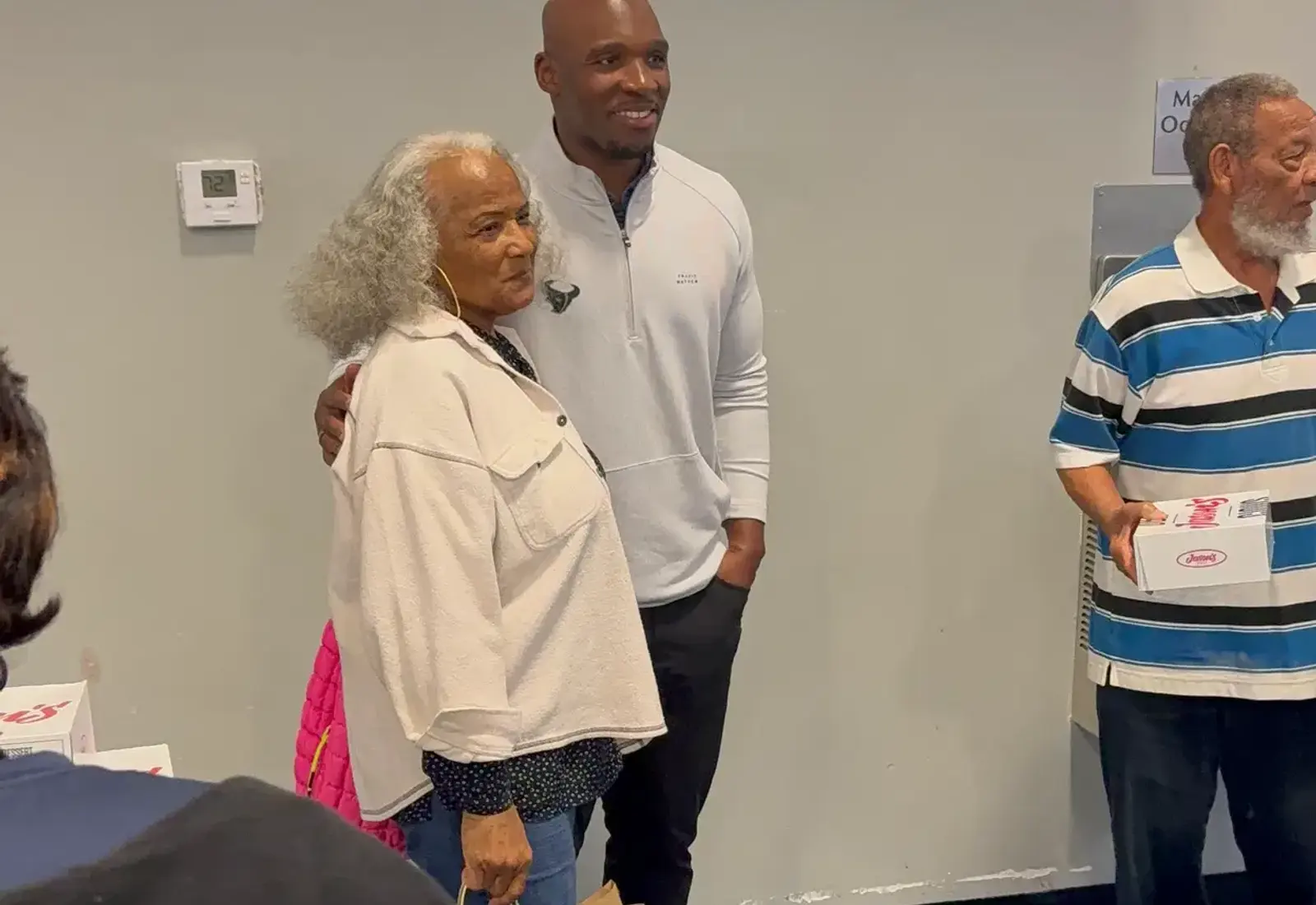 DeMeco Ryans connecting with community members at a local outreach event